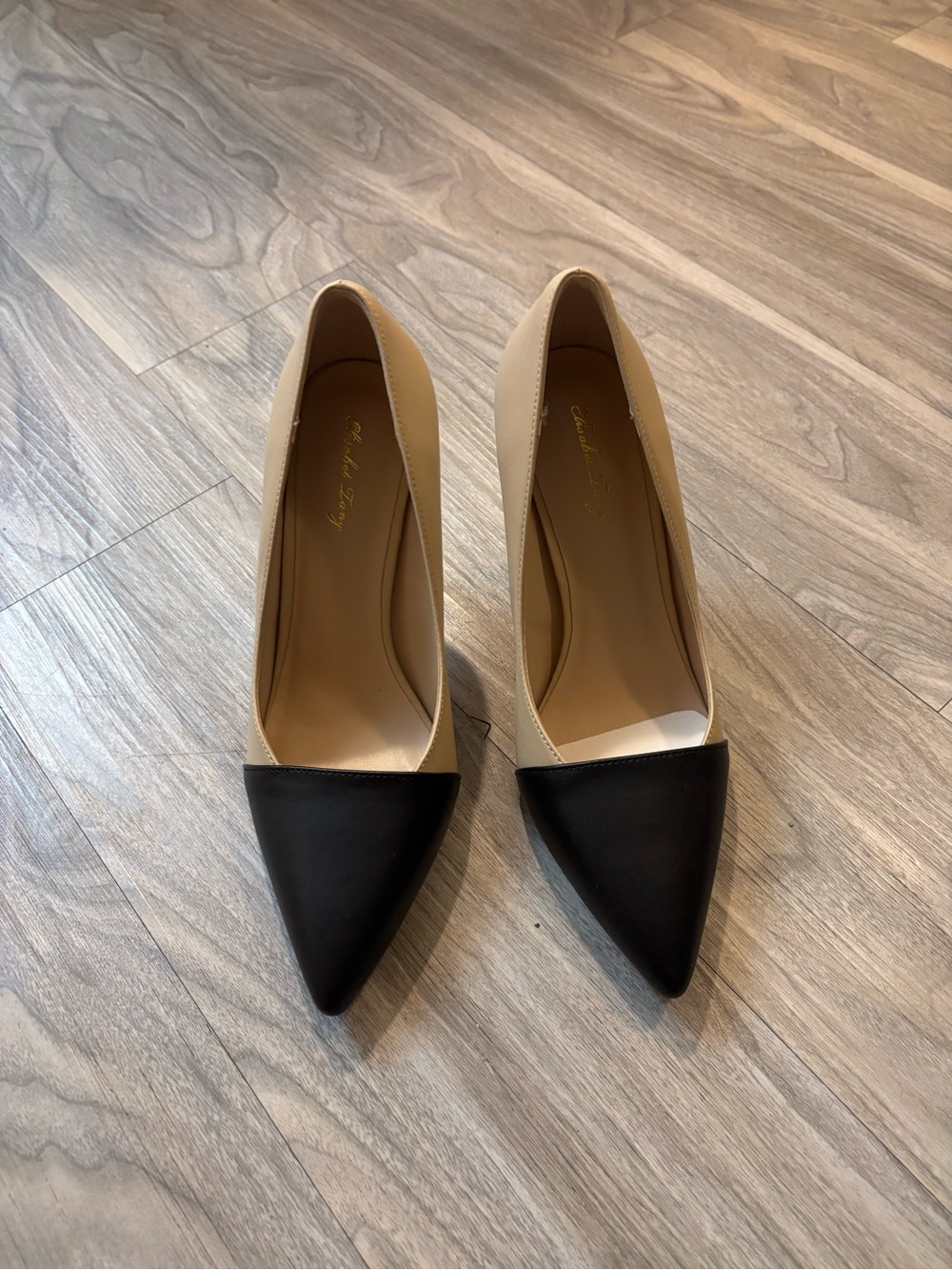Two-Tone Black and Cream Pointed Toe Pumps